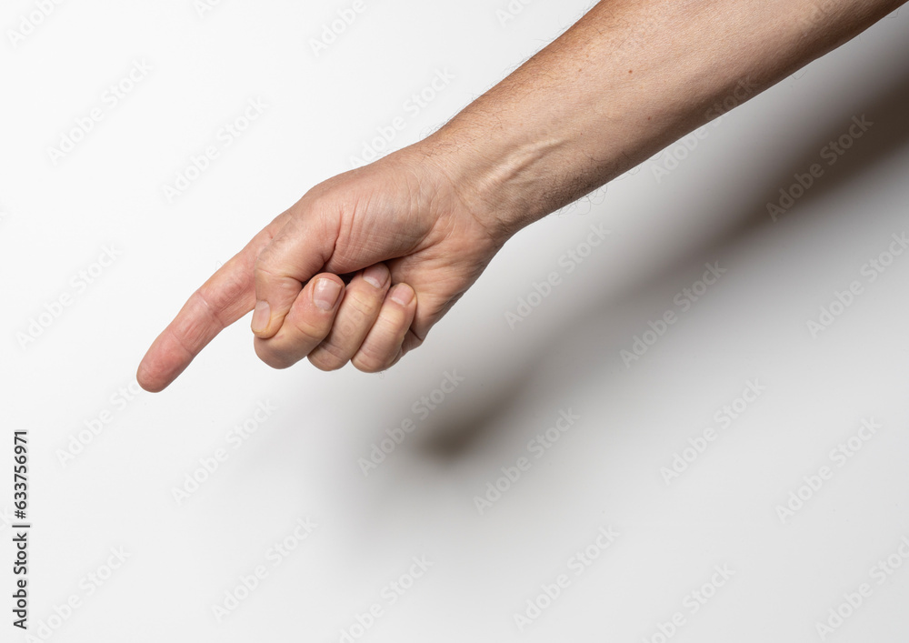 a male hand pointing with a finger