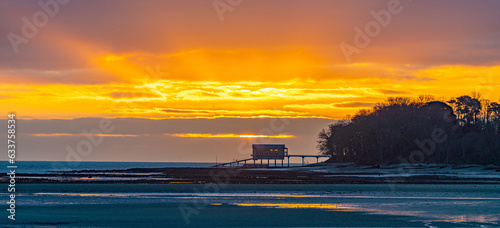 Sunset over a pier.