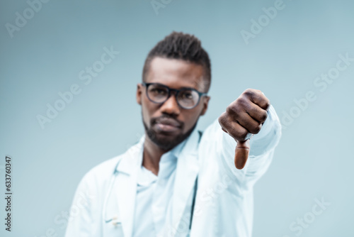 Black doctor's thumbs-down; disapproves unscientific choices photo