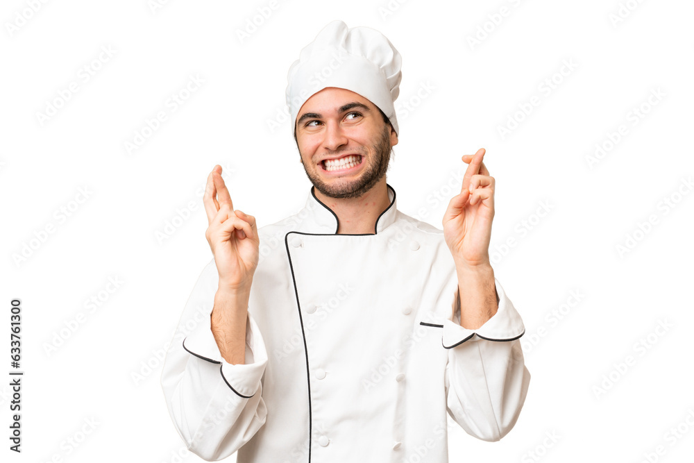 Young handsome chef man over isolated background with fingers crossing Young handsome chef man over isolated background with fingers crossing
