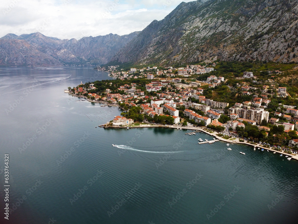 Aerial drone high view of Kotor bay, Boka Kotorska and coastal town Kotor, Cattaro, in Montenegro. Location place famous resort Montenegro. Adriatic fjord surrounded by rugged mountains
