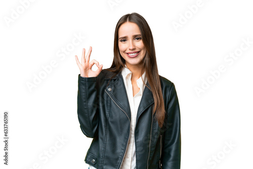 Young beautiful woman over isolated chroma key background showing ok sign with fingers