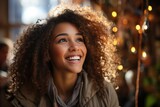 Outdoor portrait of happy girl tourist with curly hair. Woman looking away.