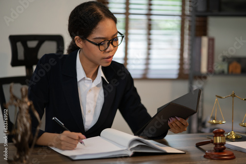 Lawyers Asiawoman   having through online Concepts  of Legal services at the law office. photo