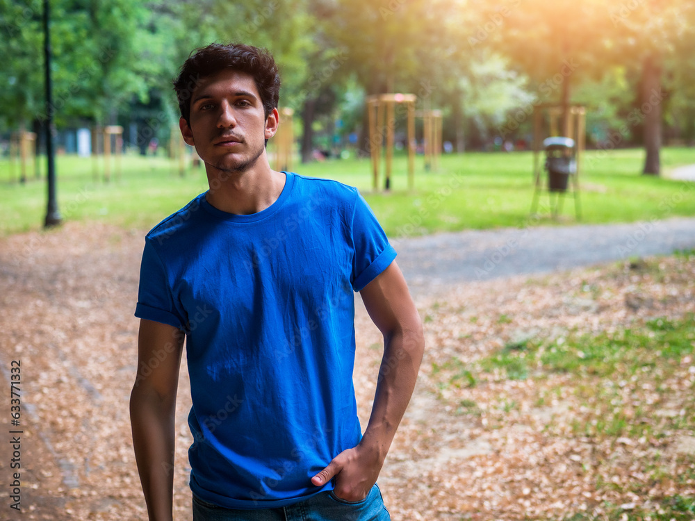 Fototapeta premium Three quarters shot of one handsome young man in urban setting
