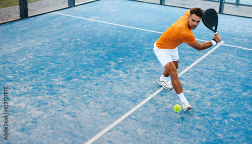 Competitive padel player receives shot on court in sports tournament photo