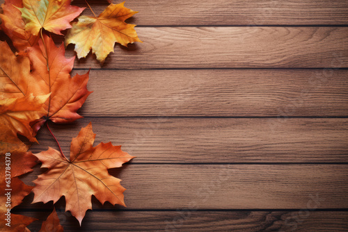 Autumn leaves on wooden background - nagative space for designers