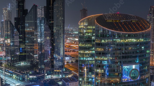 Dubai international financial center skyscrapers aerial day to night timelapse.