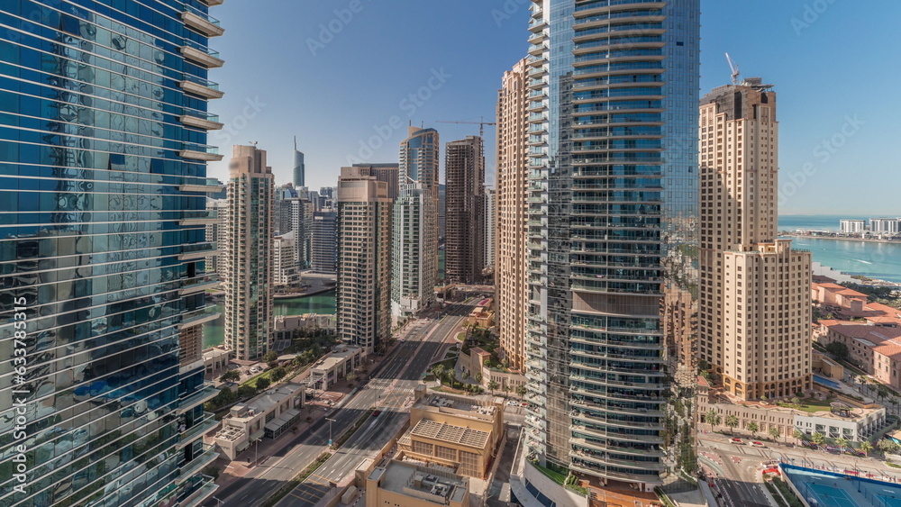 Fototapeta Panoramic view of the Dubai Marina and JBR area and the famous Ferris Wheel aerial timelapse