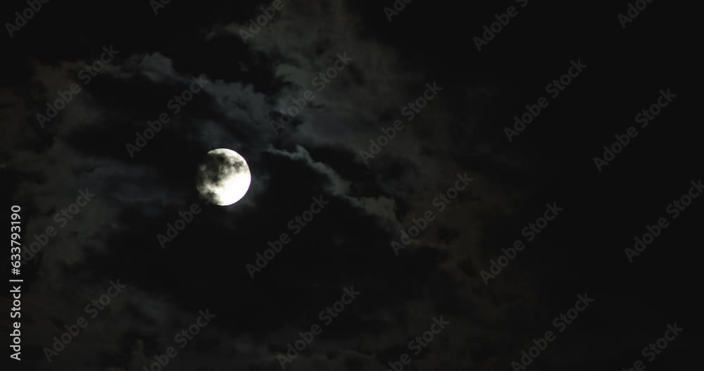 As the night progresses, the moon moves across sky.