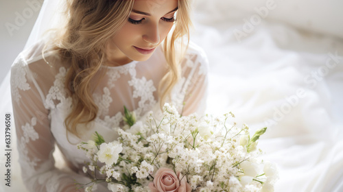 Beautiful european young bride in a wedding dress with a bridal bouquet