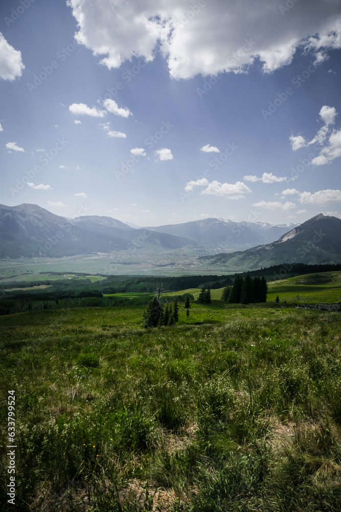 Beautiful view of Crested Butte meadows and forest and mountains in summer in Colorado