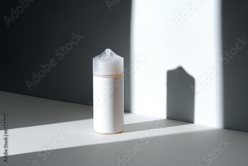 Wallpaper Mural Dropper bottle with vape liquid on white background in the sunlight with shadows Torontodigital.ca