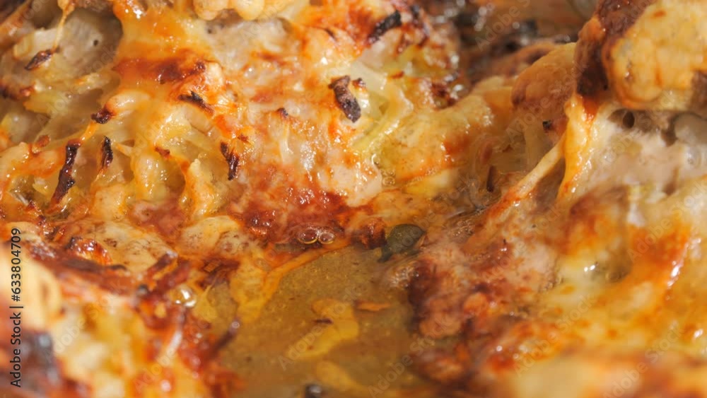 A fried piece of mini lasagna fresh from the oven. The fat is still warm and bubbling A fried piece of mini lasagna fresh from the oven. The fat is still warm and bubbling