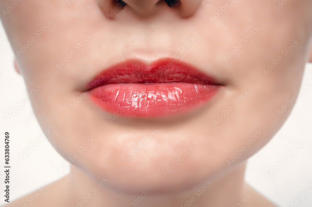 Fototapeta premium Women's lips are red, close-up. Seductive red lips