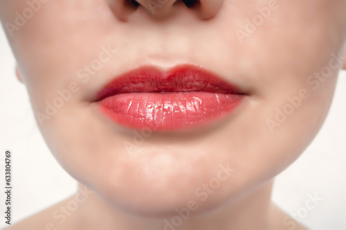 Women s lips are red  close-up. Seductive red lips