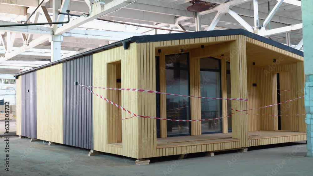 Newly built single storey prefabricated modular building. Prefabricated mobile wooden house at construction site