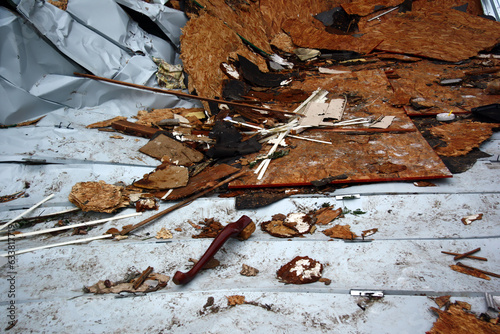 Canvas Print A large pile of broken wood and other debris lies on the ground after a storm