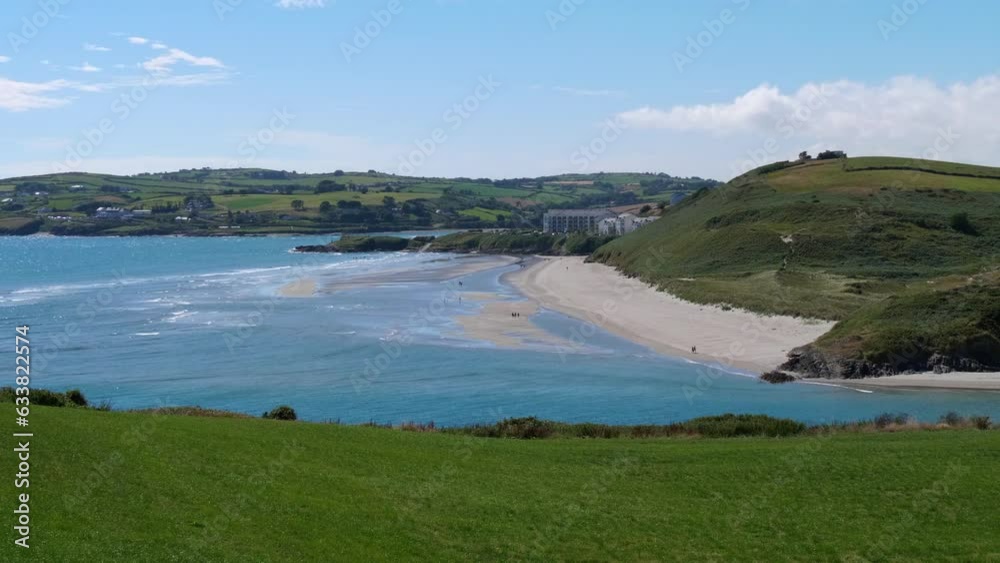 View of the famous Irish beach of Inchydoney, near Clonakilty on a sunny summer day. Beautiful turquoise sea water. Irish landscape. View of the famous Irish beach of Inchydoney, near Clonakilty on a sunny summer day. Beautiful turquoise sea water. Irish landscape.