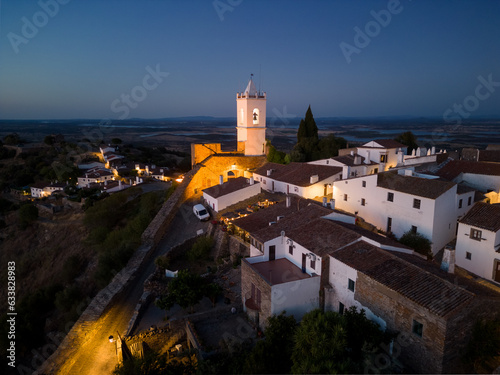 Aerial view of the Monsaraz Castle on a hill at sunset, Portugal