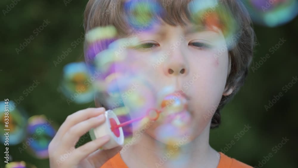 Little Boy Blowing Soap Bubbles Having Fun Playing Outside, Child Innocence and Curiosity. Boy Kid Blowing Soap Bubbles in Park, Garden and Nature, Having Fun, Joy and Childhood Development, Freedom. Little Boy Blowing Soap Bubbles Having Fun Playing Outside, Child Innocence and Curiosity. Boy Kid Blowing Soap Bubbles in Park, Garden and Nature, Having Fun, Joy and Childhood Development, Freedom.