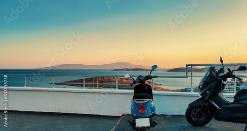 Motorbike at sunset time near sea coast line. Scooters parked by the sea