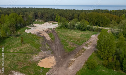 Top drone view of construction site in forest. White sand. Nature of Jurmala. Baltic sea. photo