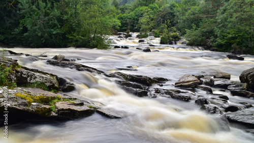 Falls of Dochart waterfall, silky smooth water. Long exposure photography. photo