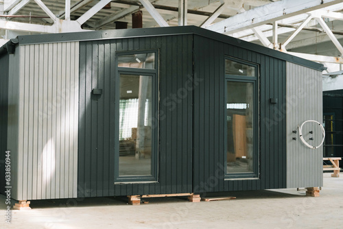 Modular apartment house of frame type in construction site. Mobile eco-friendly space for living and tourism