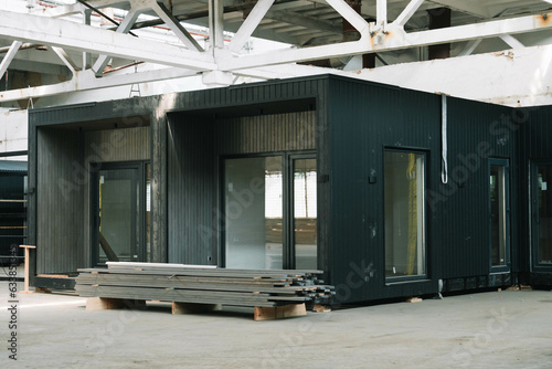A new wooden modular prefabricated house inside an industrial building
