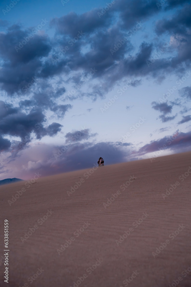 desert with cloudy sky during sunset