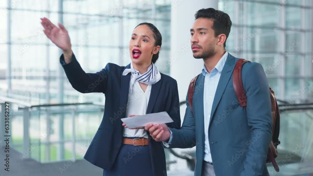 Woman, man and point for direction at airport concierge, help and question with check in lobby. Confused entrepreneur, airline service employee and show documents for identity, travel and information Woman, man and point for direction at airport concierge, help and question with check in lobby. Confused entrepreneur, airline service employee and show documents for identity, travel and information