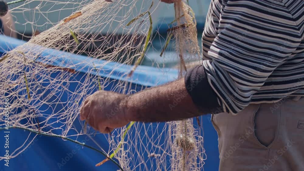 Fisherman Cleans Their Nets And Prepares New Fish Footage.