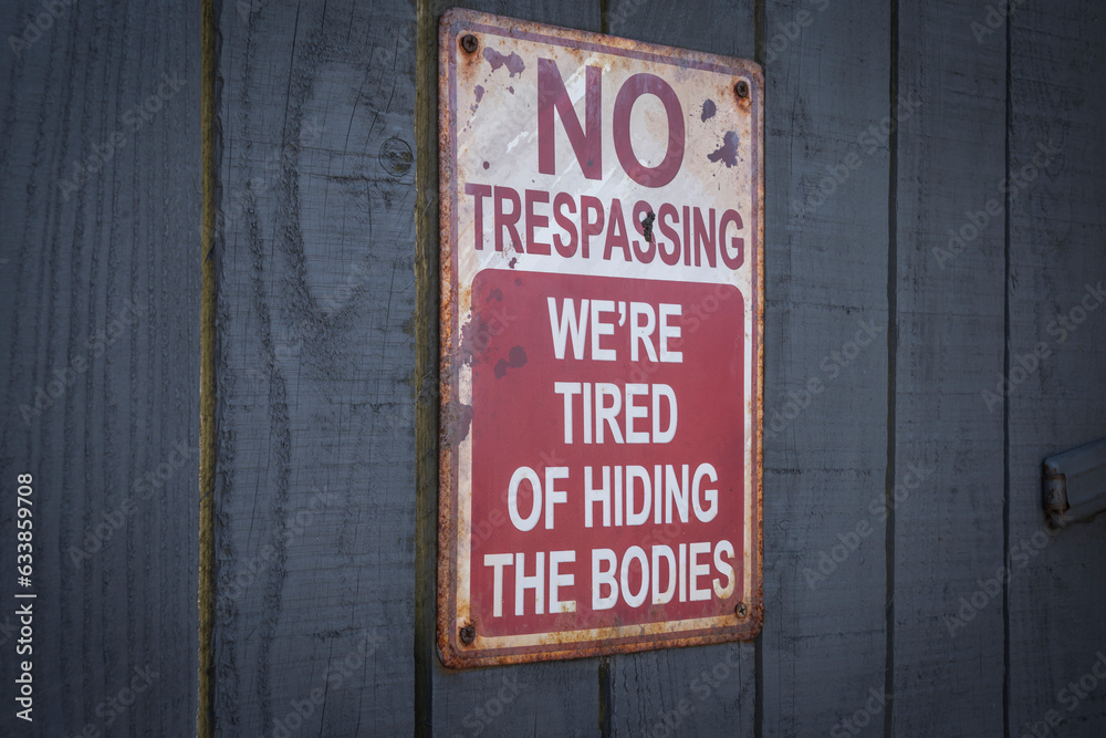 no trespassing sign on a wooden door no trespassing sign on a wooden door