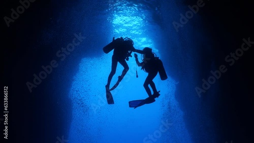 Wallpaper Mural cave diving underwater scuba divers exploring caves and having fun ocean scenery sun beams and rays background Torontodigital.ca