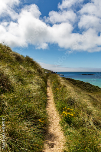 Looking along a coastal path on a hillside above Sennen in Cornwall
