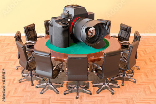 Round table with digital camera and armchairs around, 3D rendering photo