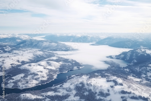 Aerial View of a Breathtaking Winter Wonderland Landscape with Snow-Covered Mountains and Frozen Lakes