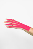 aesthetic hand taping. female hand with pink kinesio tape. hand skin care, non-surgical hand skin tightening using kinesio tapes