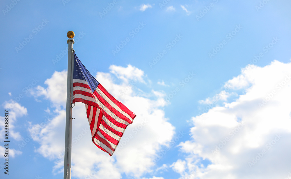 US flag waves proudly, embodying American patriotism and honor on this special holiday, symbolizing unity and freedom US flag waves proudly, embodying American patriotism and honor on this special holiday, symbolizing unity and freedom