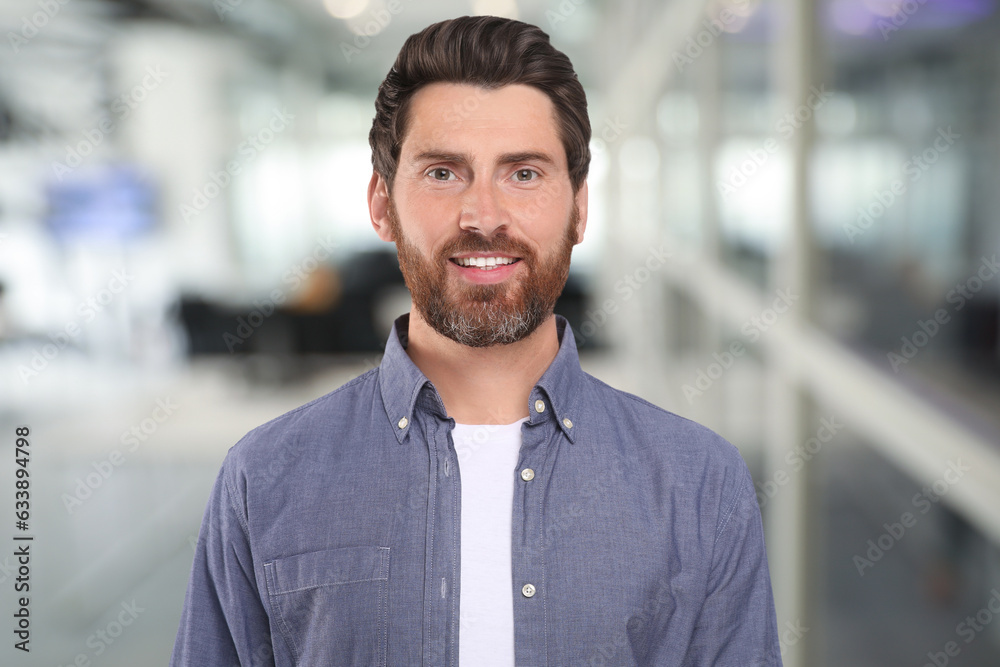 Portrait of handsome confident man in office Portrait of handsome confident man in office