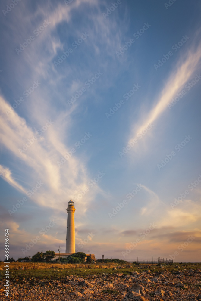Lighthouse of San Vito Lo Capo at sunrise time with beautiful clouds. Sicily island, Italy. Popular travel destination. June 2023