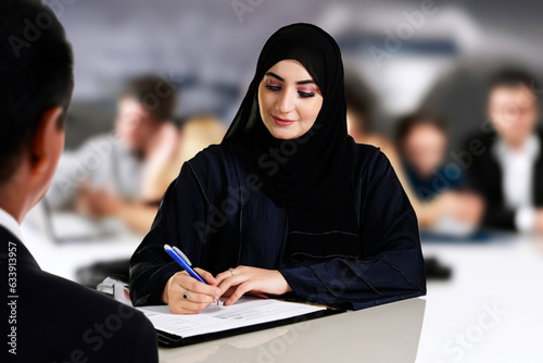 Canvas Print Emarat bank teller or customer signing a contract inside a financial bank