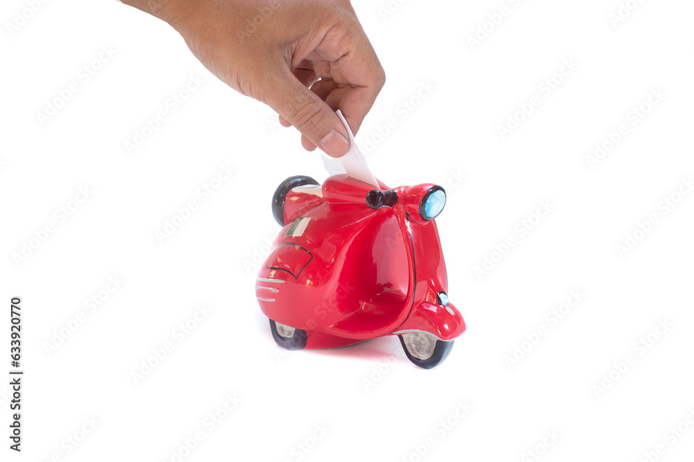 Fototapeta premium south east asian hand saving money to a ferari red scooter piggy bank in isolated white