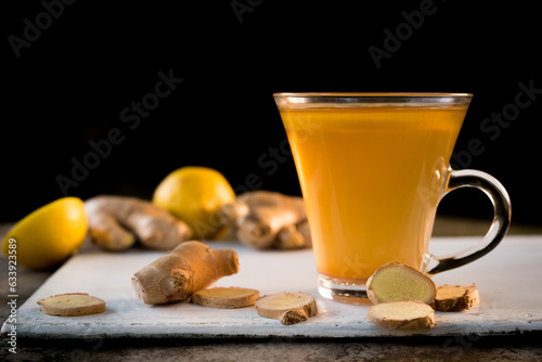 Ginger tea with lemon in a glass