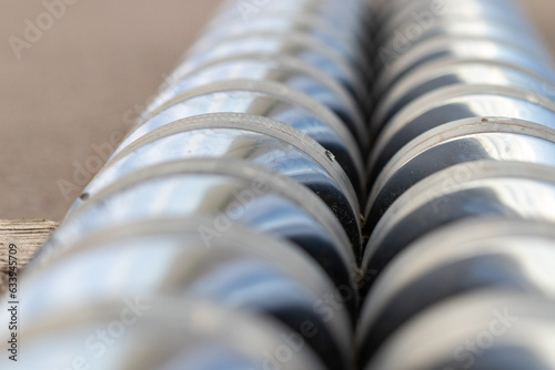 Top view Close-up injection machine screw spare parts injection machine manufacturing process concept.