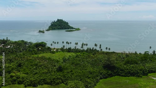 Wallpaper Mural Aerial view of tropical island with green trees under clear sky and clouds. Davao Oriental, Philippines. Torontodigital.ca