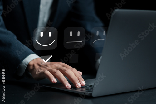 Customer service and Satisfaction concept, businessman rate satisfaction with smiley face icon in service, very impressed rating.