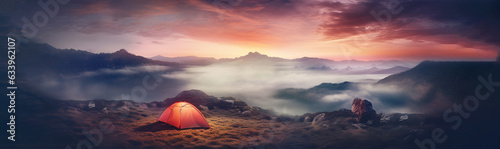 Tent on grass with sunset in the background