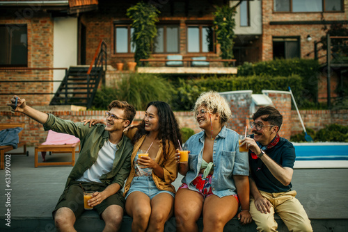 Wallpaper Mural Friends having a selfie during a backyard party. Torontodigital.ca